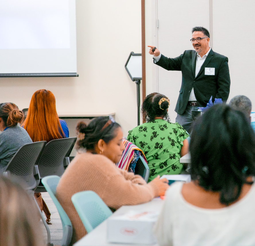 An ELSSA member speaks in front of a room